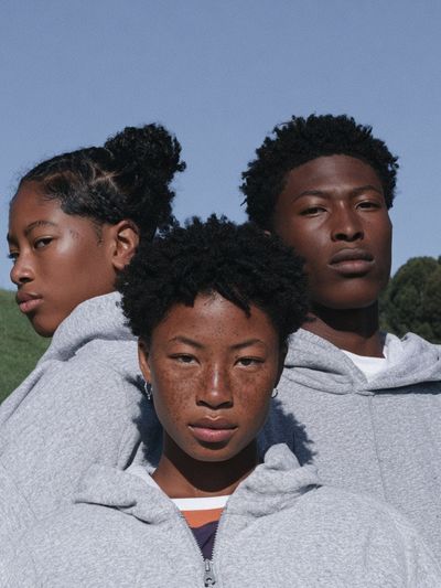 Three Portraits in Grey Hoodie Poster.