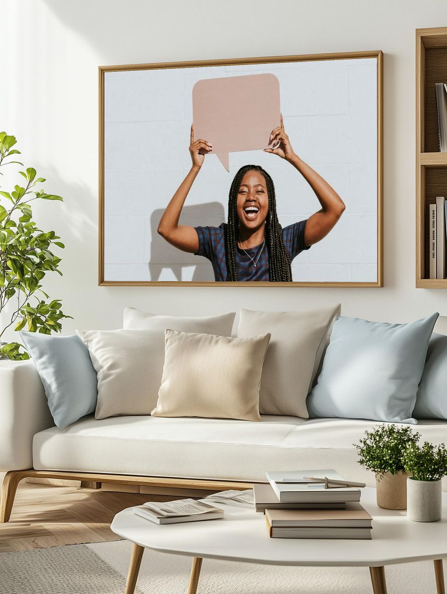 Cheerful black woman showing blank. — room view 2