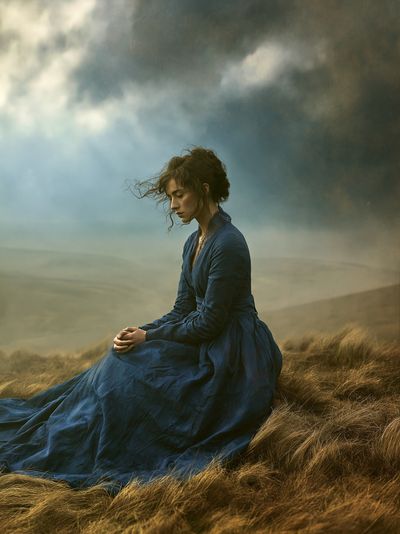 Solitary Woman in Stormy Fields Poster.