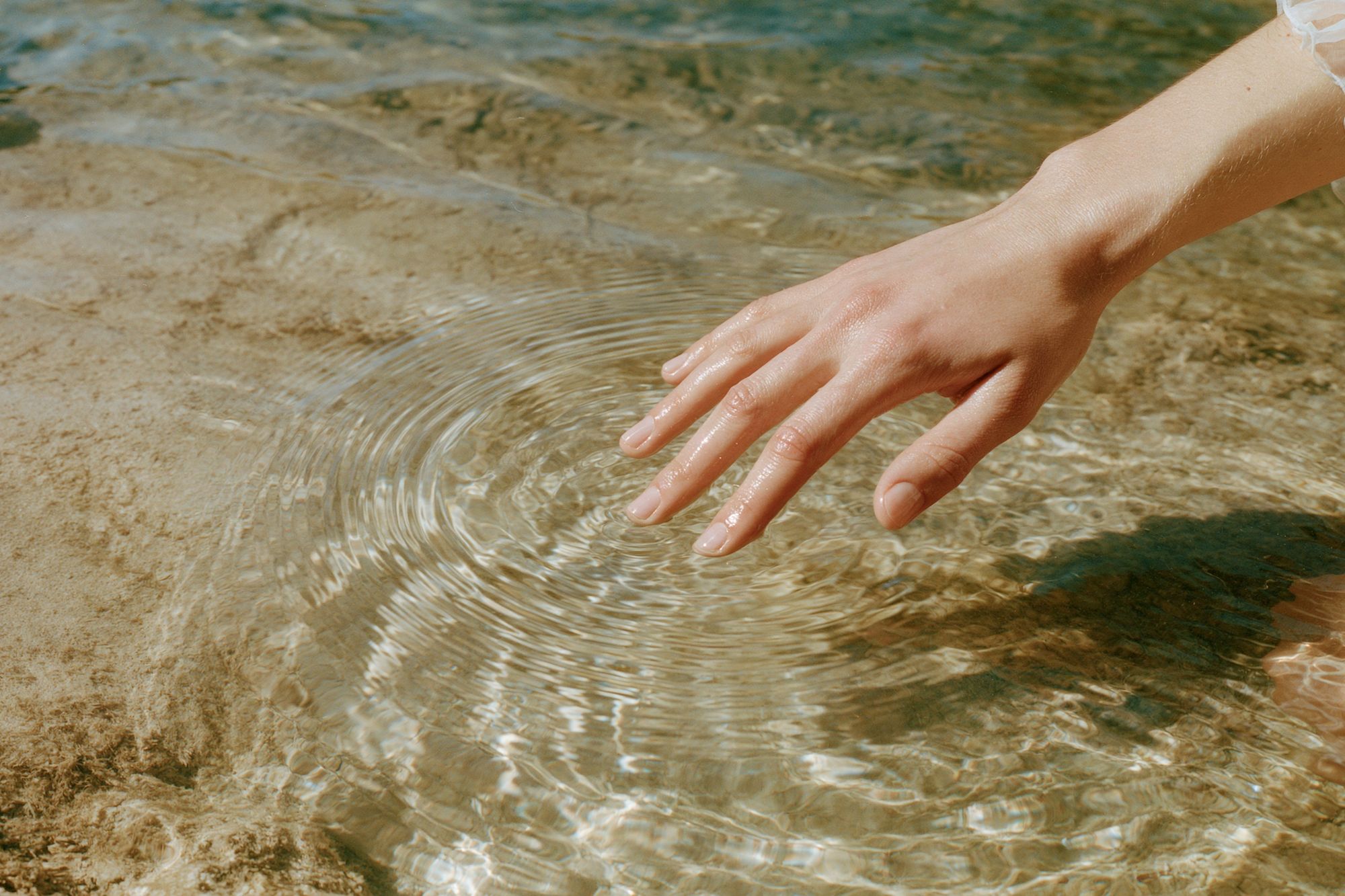 Hand in Sunlit Water Photography Poster. poster — photography art