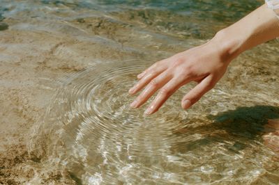 Hand in Sunlit Water Photography Poster. poster print