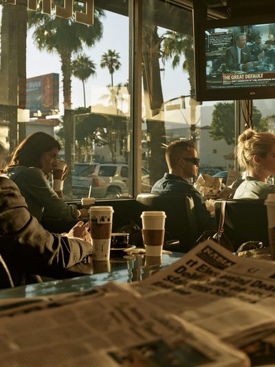 Sunlit Coffee Shop Scene Photography Poster.