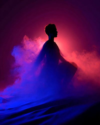 Silhouette in Colorful Smoke Poster. poster print