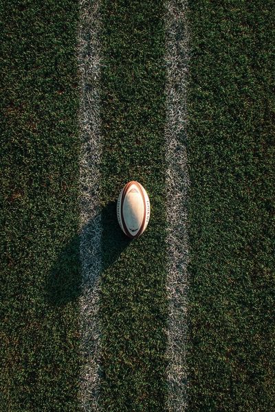 Rugby Ball on Field — Sports Print