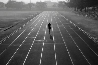 Runner on Track — Black and White Photography Print. poster