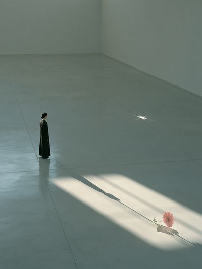 Solitary Figure with Flower Poster. poster