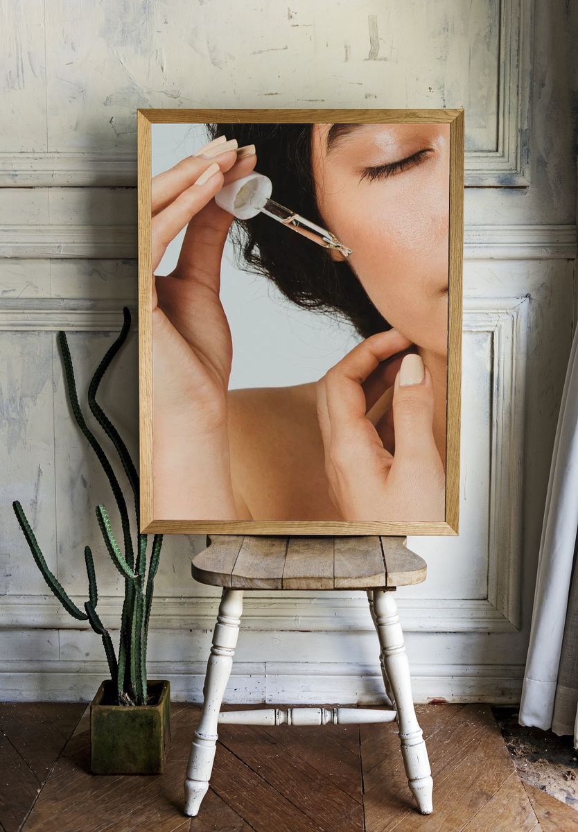 Young woman applying serum her. — room view 1