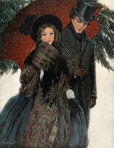 elegantly dressed couple walk arm.