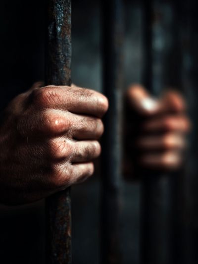 Hands Gripping Prison Bars — Photography Print. poster print