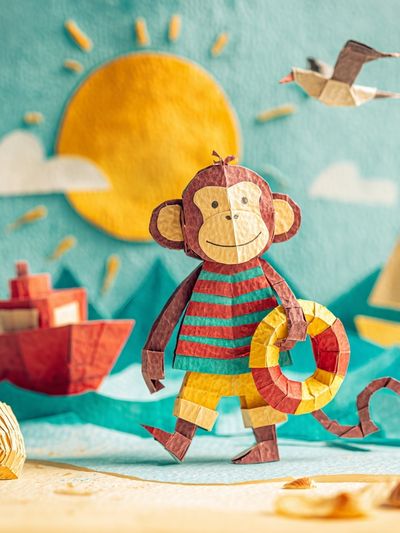 Playful Monkey Beach Scene Poster.