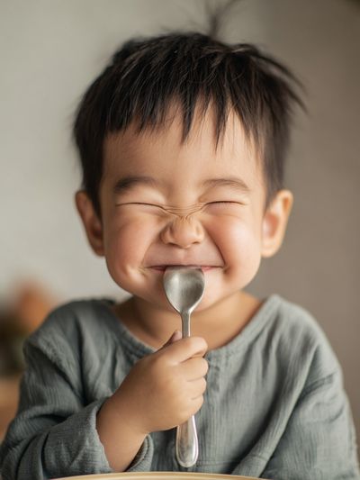 Happy Child with Spoon — Photography Print