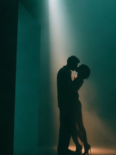 Silhouetted Lovers in Green Light Poster. poster print