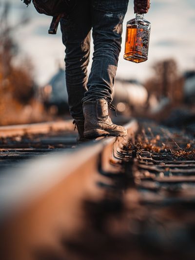 Railroad Walk with Whiskey Poster. poster