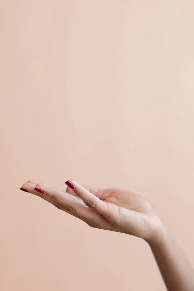 Female hand beige background. poster — photography art