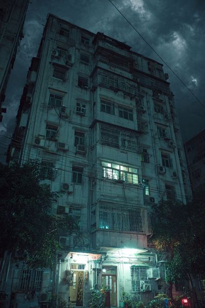 Rainy Apartment Block Night Poster. poster print
