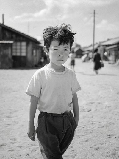 Boy in Village Street Photography Poster. poster