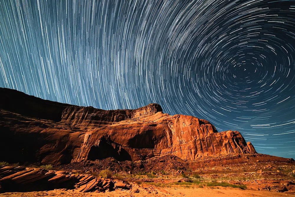 Star Trails Over Monument Valley — Photography Print. poster detail
