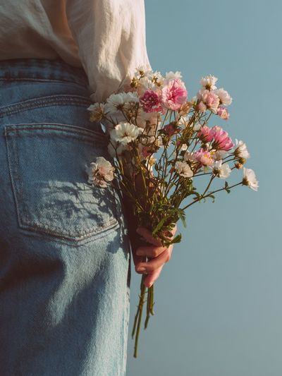 Woman Holding Flowers — Photography Print. poster